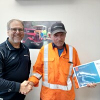 L R Lee Skinner Regional GM presenting Neil Mc Laren Hautapu Plant Manager with his 20 years of service award