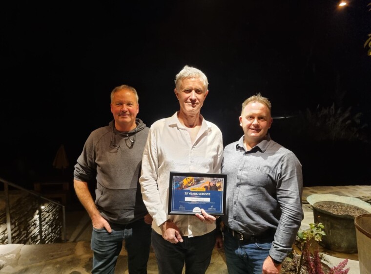 L R Gavin Magrath Area Manager Shane Tell Queenstown Manager and Simon Elliotte Regional GM presenting Shane with his 25 years of service