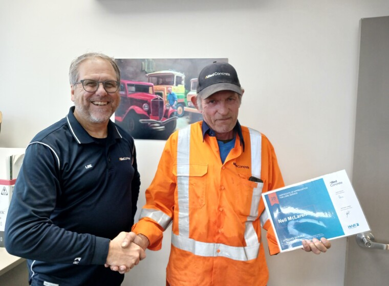 L R Lee Skinner Regional GM presenting Neil Mc Laren Hautapu Plant Manager with his 20 years of service award