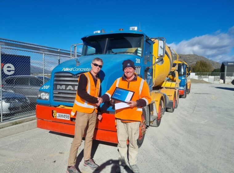 L R Shane Tell Queenstown Manager presenting Scott Gates Driver on his 25 years of service