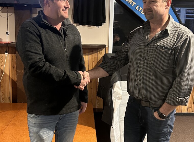 L R Shannon being congratulated by Brad Kincaid for his 25 years of service