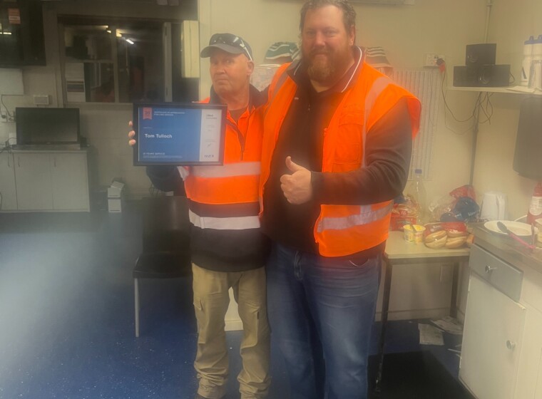 L R Tom Tulloch Driver being presented his 20 years of service award by Mike Smith Christchurch Manager
